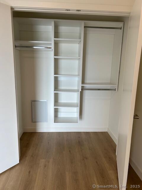 42 John Street, Unit 506 Stamford, CT 06902 - Photo 17 of 23 a view of a room with wooden floor and a window