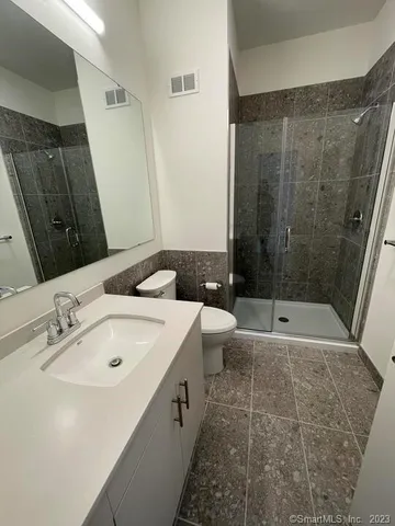 a bathroom with a bathtub and a sink