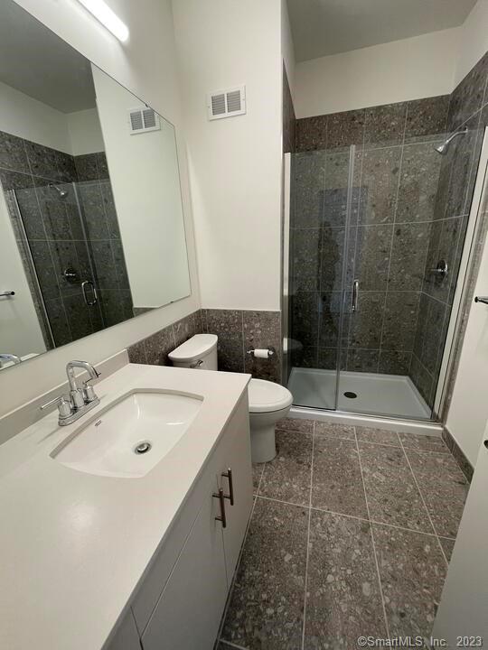 42 John Street, Unit 506 Stamford, CT 06902 - Photo 5 of 23 a bathroom with a bathtub and a sink