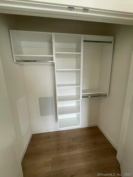 42 John Street, Unit 506 Stamford, CT 06902 - Photo 6 of 23 a view of a room with a wooden floor and a window