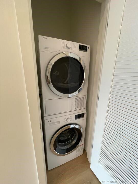 42 John Street, Unit 506 Stamford, CT 06902 - Photo 7 of 23 a utility room with dryer and washer