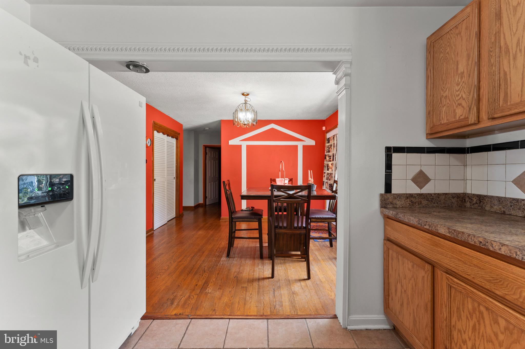 8426 Avery Road Baltimore, MD 21237 - Photo 13 of 25 a hallway with dining table and chairs