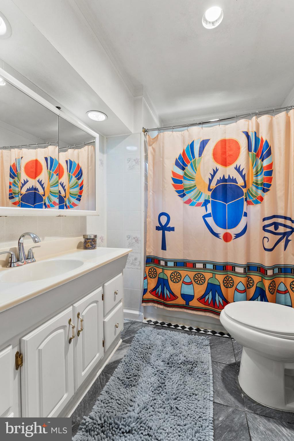 8426 Avery Road Baltimore, MD 21237 - Photo 15 of 25 a bathroom with a a sink and a painting on the wall