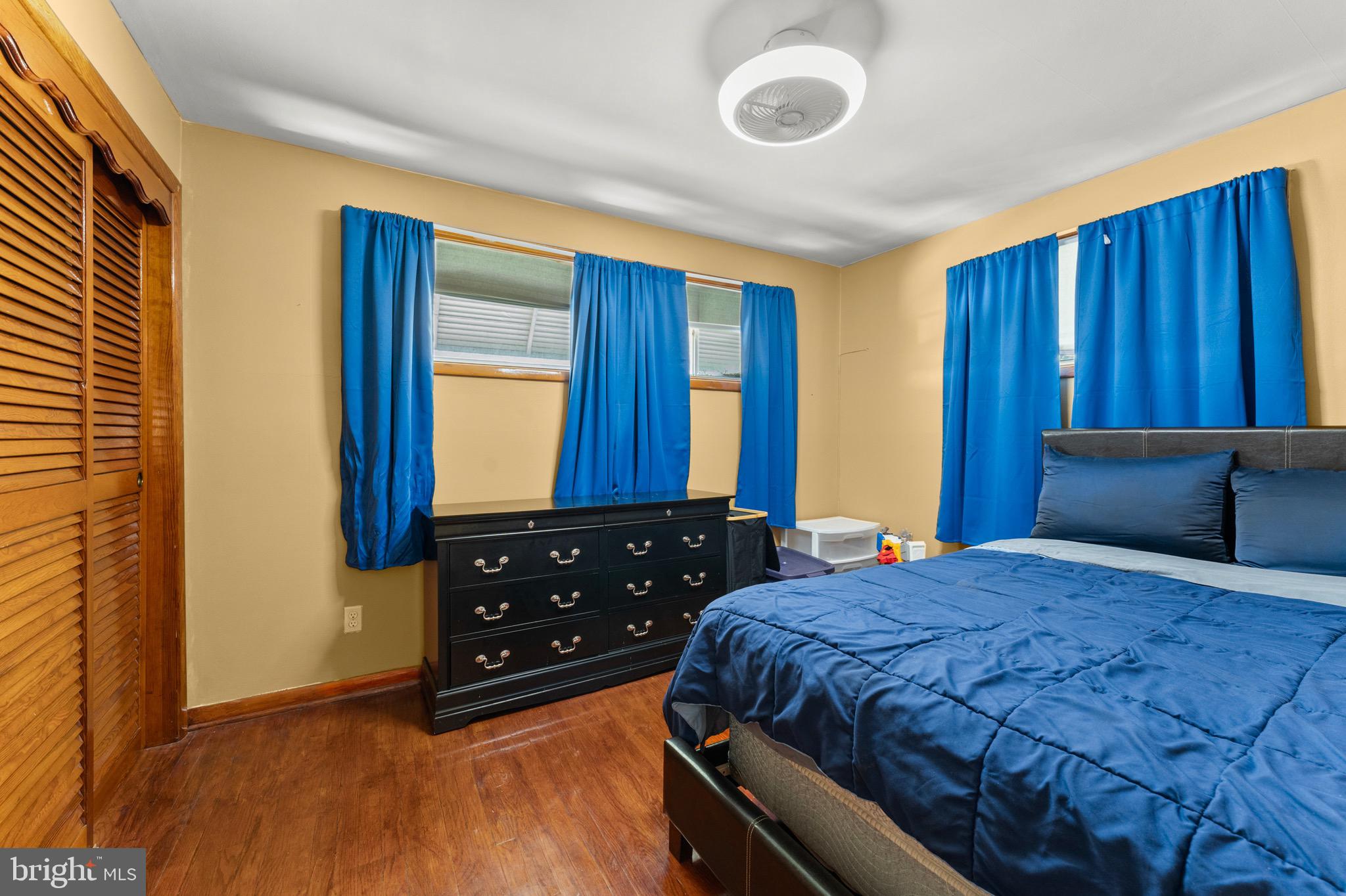 8426 Avery Road Baltimore, MD 21237 - Photo 16 of 25 a bedroom with a bed and a dresser