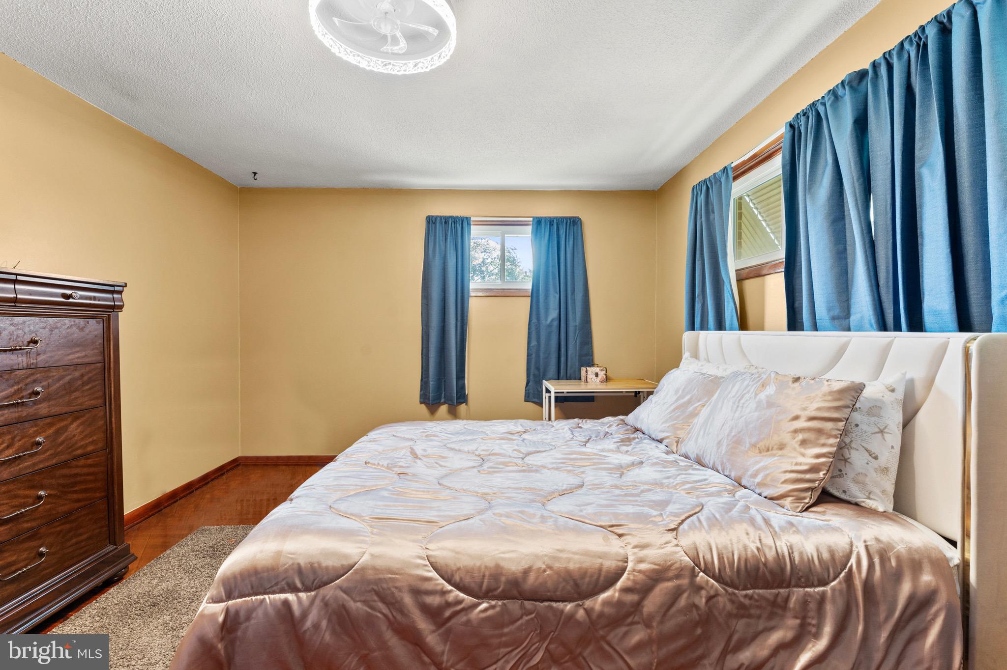 8426 Avery Road Baltimore, MD 21237 - Photo 17 of 25 a bedroom with a bed and a window