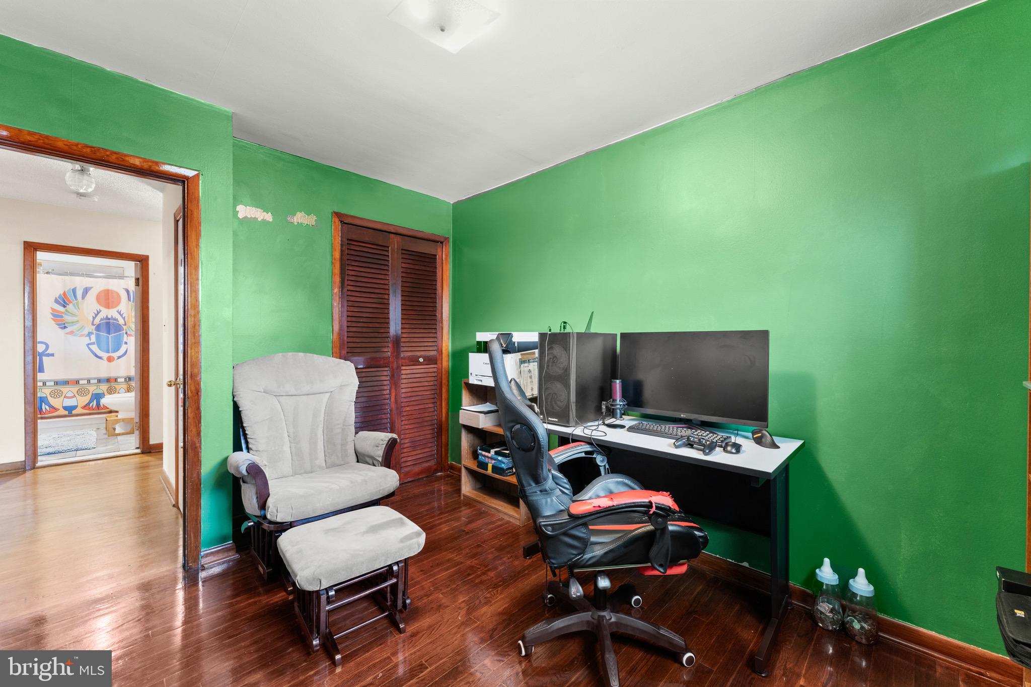 8426 Avery Road Baltimore, MD 21237 - Photo 20 of 25 a living room with furniture and a flat screen tv