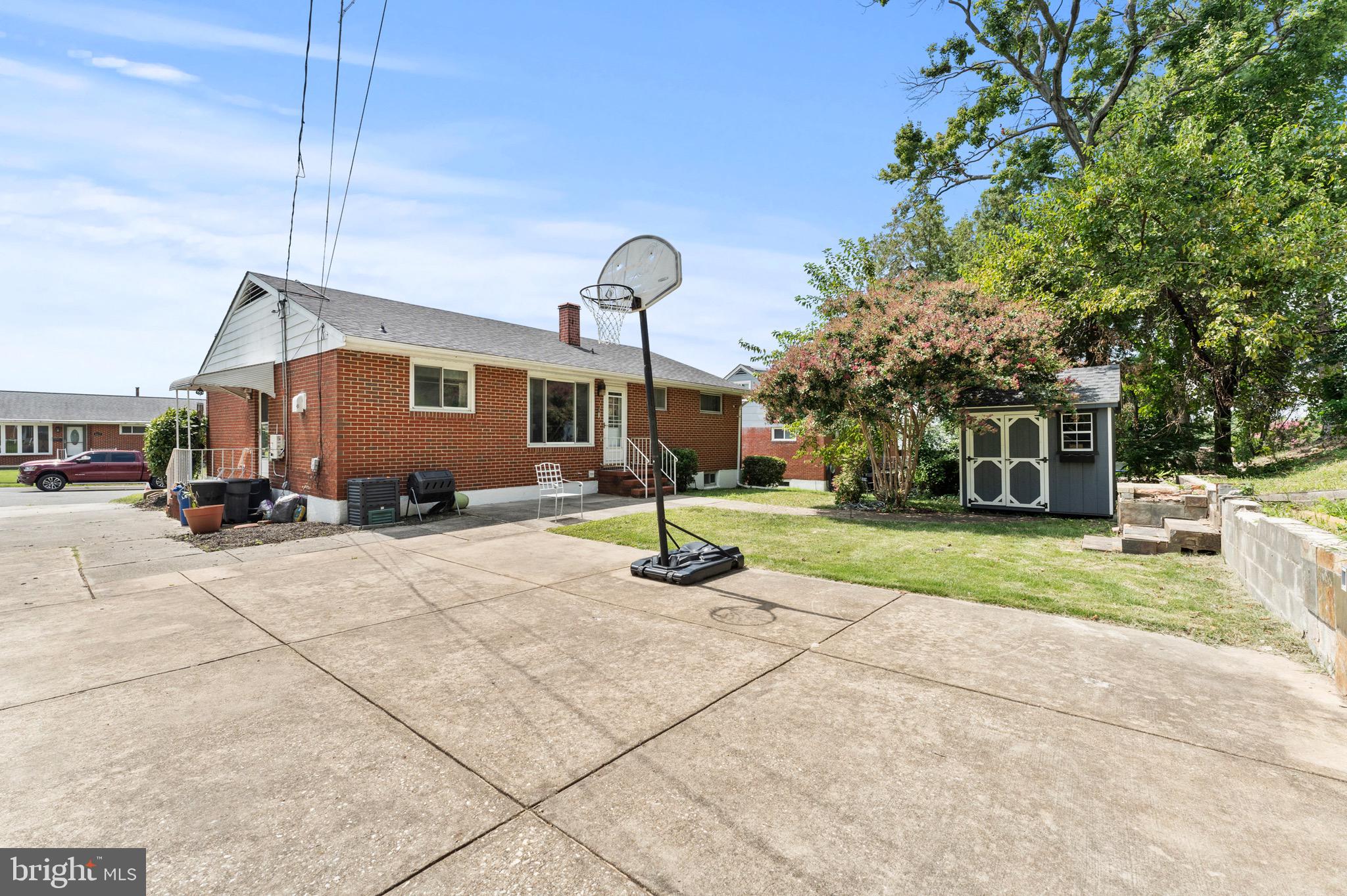 8426 Avery Road Baltimore, MD 21237 - Photo 2 of 25 a front view of a house with a yard