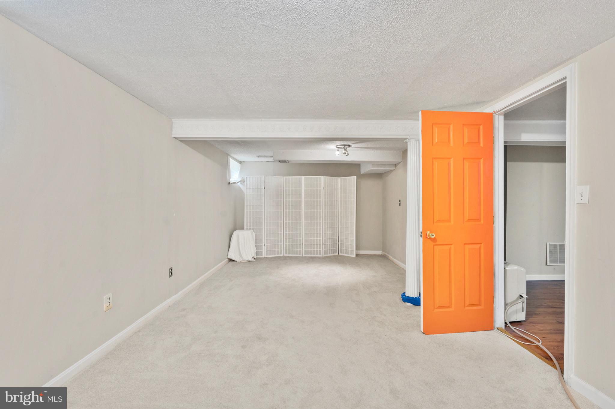 8426 Avery Road Baltimore, MD 21237 - Photo 22 of 25 a view of an empty room with a window