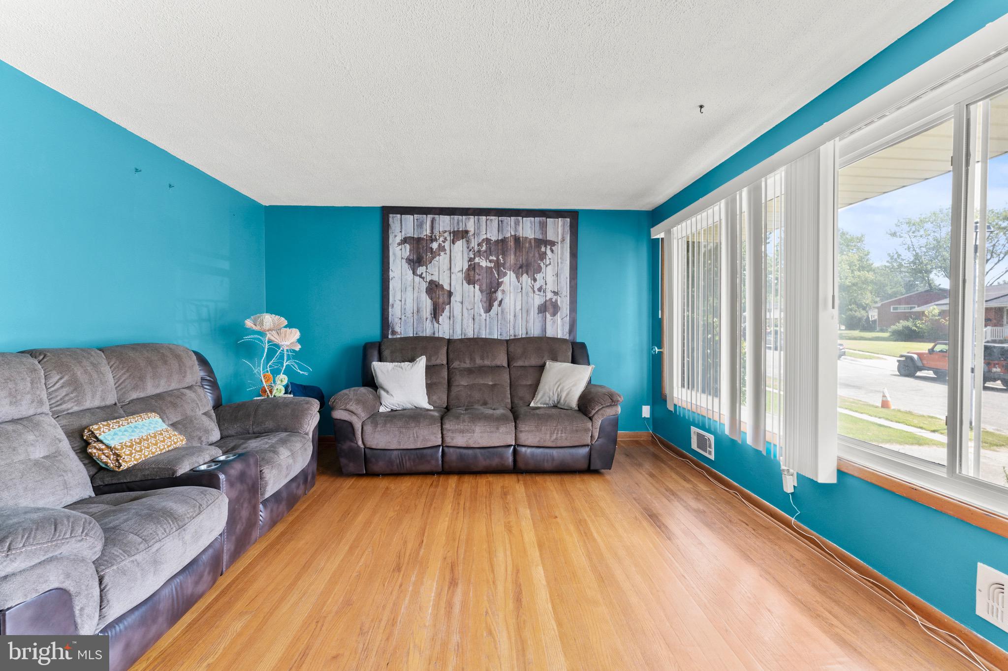 8426 Avery Road Baltimore, MD 21237 - Photo 6 of 25 a living room with furniture and a large window