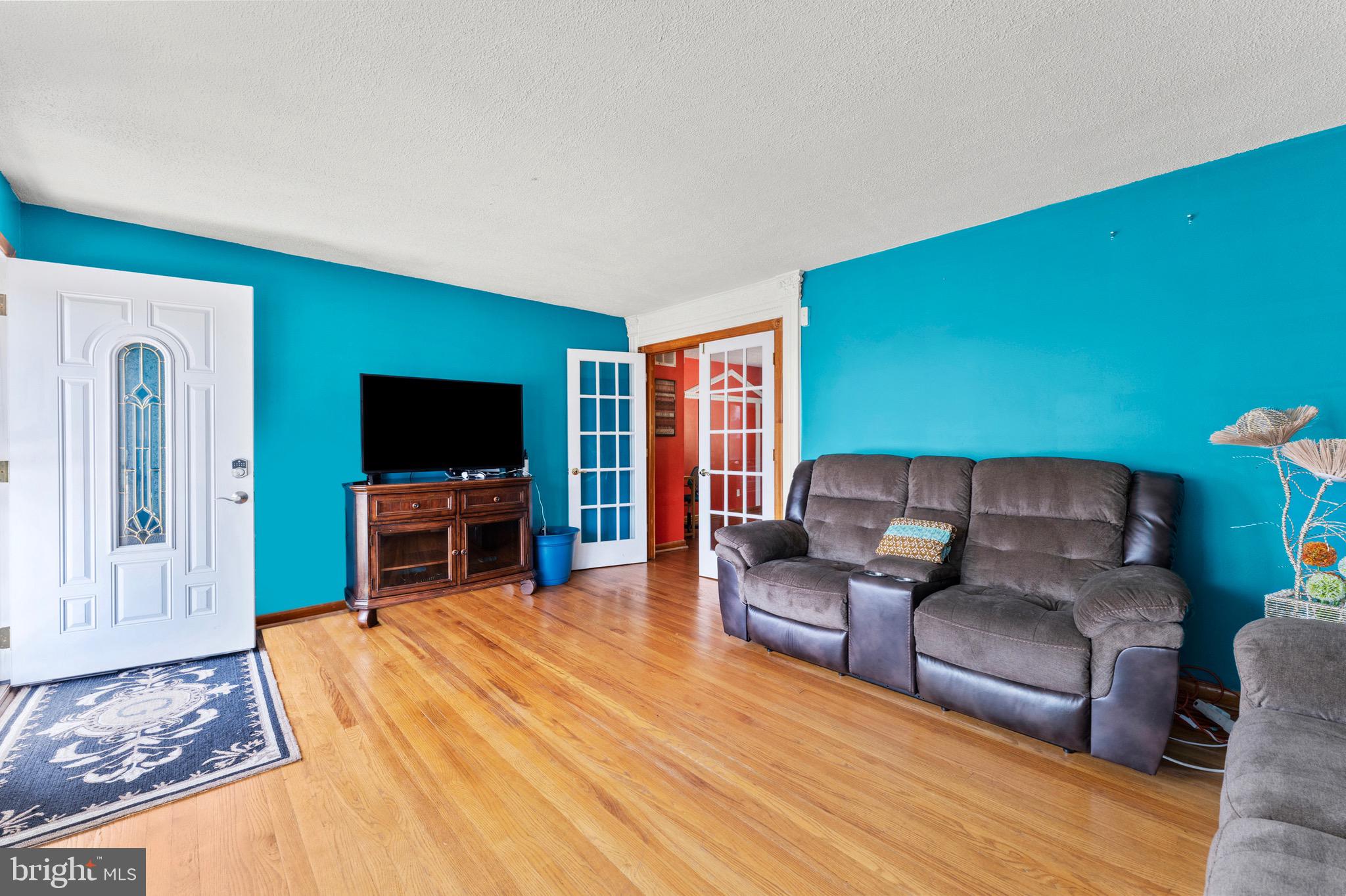 8426 Avery Road Baltimore, MD 21237 - Photo 8 of 25 a living room with furniture and a flat screen tv