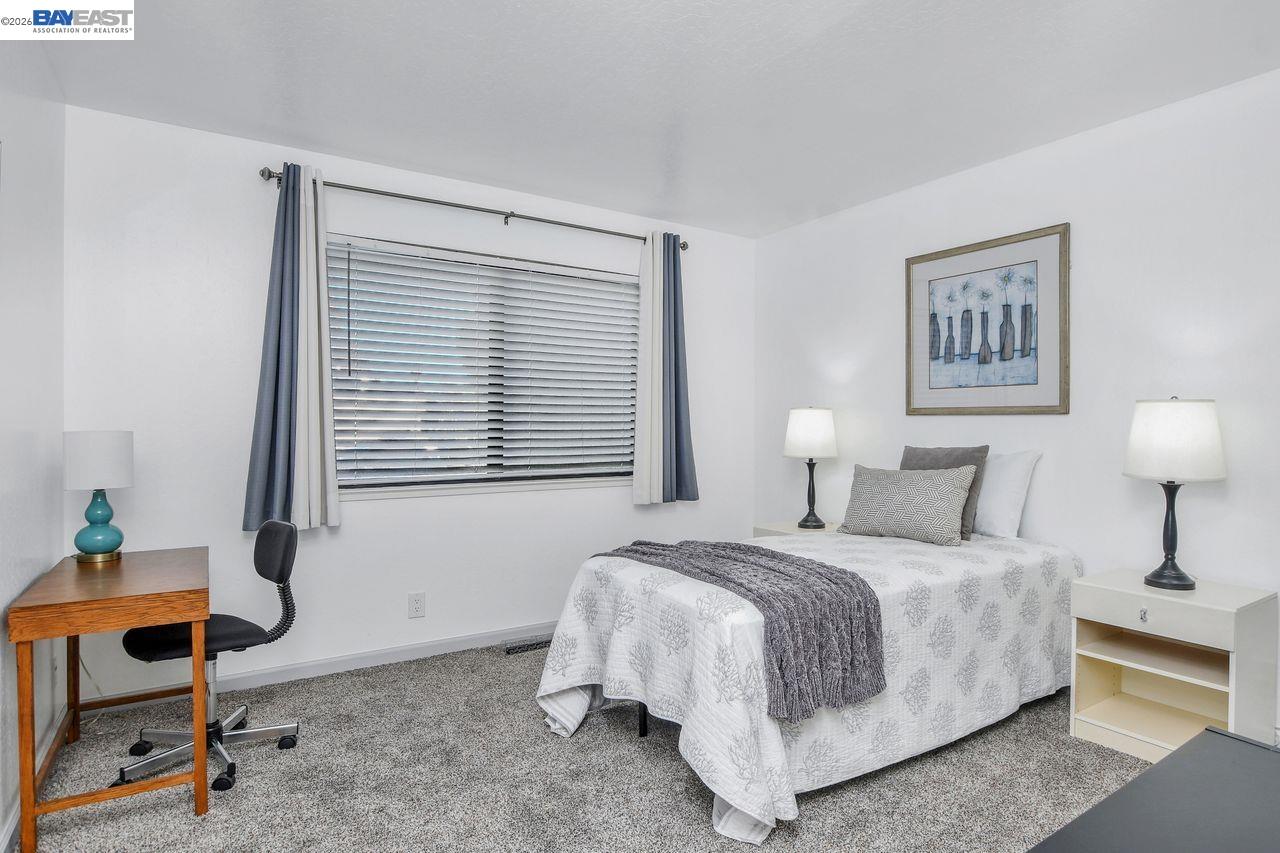 2033 Sand Point Road Discovery Bay, CA 94505 - Photo 14 of 27 a bedroom with a bed and a window