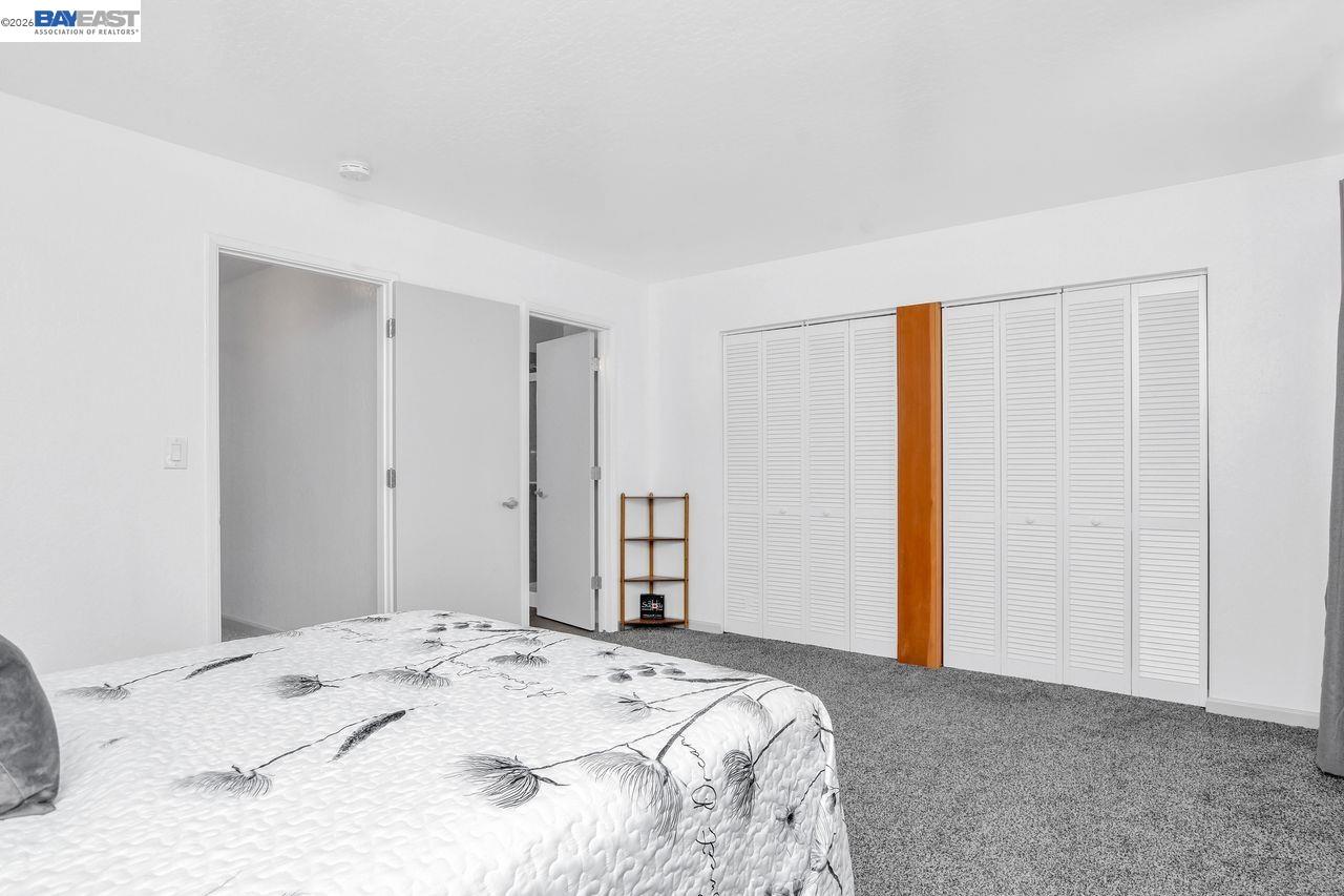 2033 Sand Point Road Discovery Bay, CA 94505 - Photo 20 of 27 a bedroom with a bed and a dresser