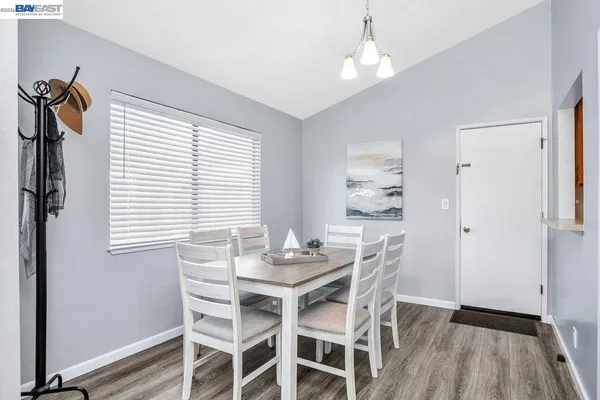 a dining room with furniture and window