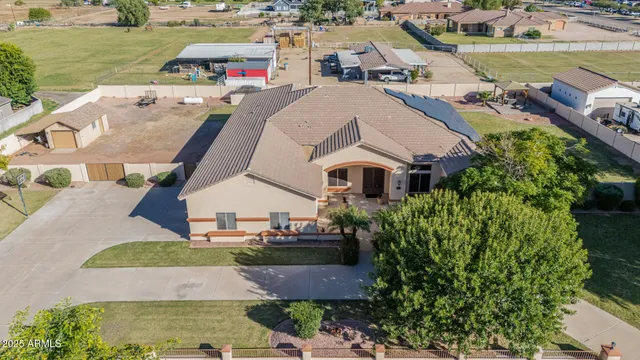 an aerial view of a house with outdoor space