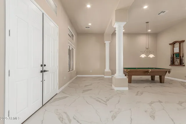 a kitchen with stainless steel appliances granite countertop a sink and a refrigerator