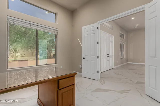 a large kitchen with lots of counter space and windows