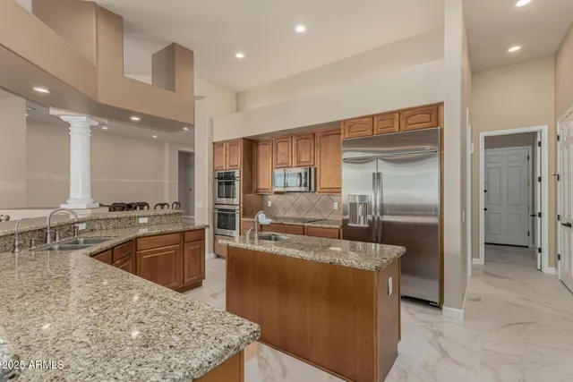 a view of a storage and utility room with washer and dryer