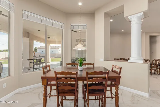 a spacious bedroom with a bed and a flat screen television