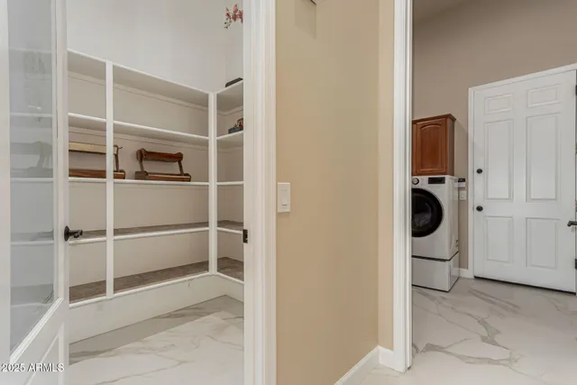 a bedroom with a bed couch and a flat screen tv