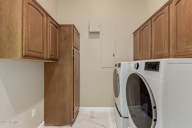 a bathroom with a sink and mirror with bathtub