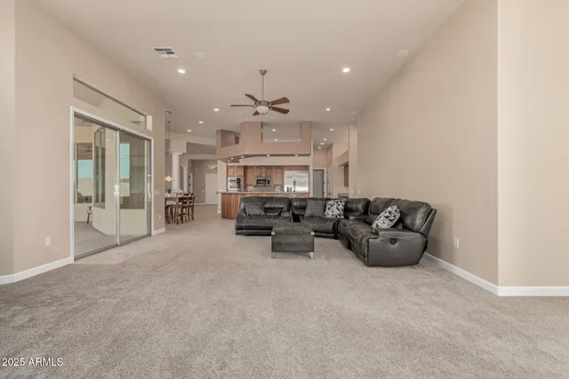 a spacious bathroom with a double vanity sink mirror and bathtub