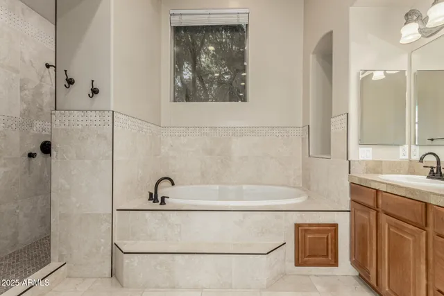 a bathroom with a double vanity sink mirror and toilet