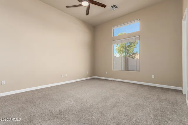 a large kitchen with kitchen island a large counter space a sink and appliances