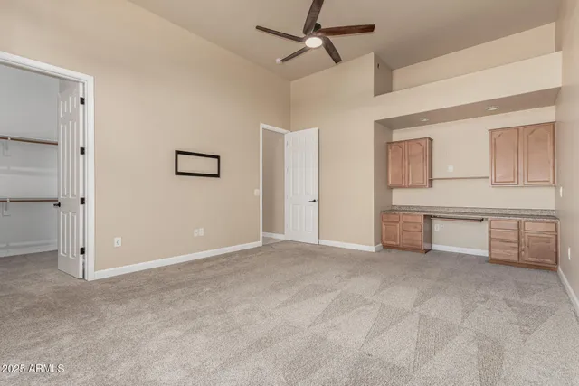 a view of a house with swimming pool and sitting area