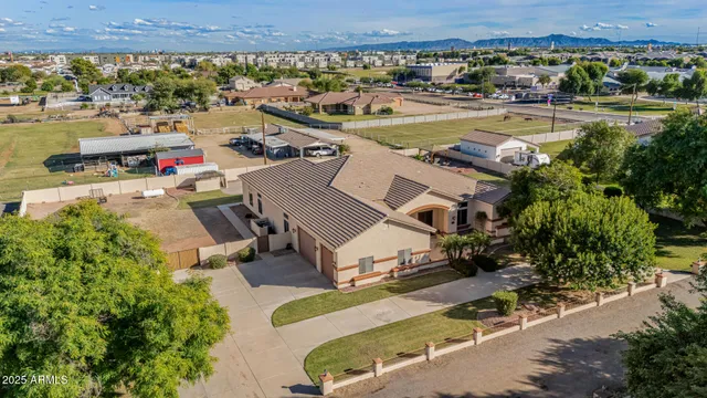 aerial view of a house with fountain and potted plants