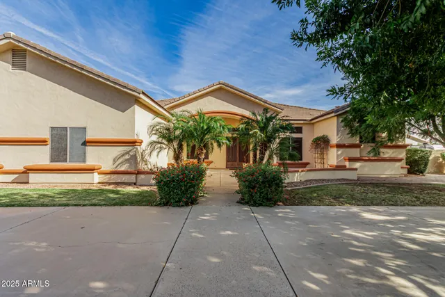 a front view of a house with garden