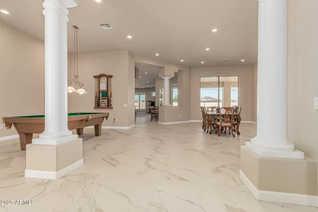 a lobby with furniture and a table