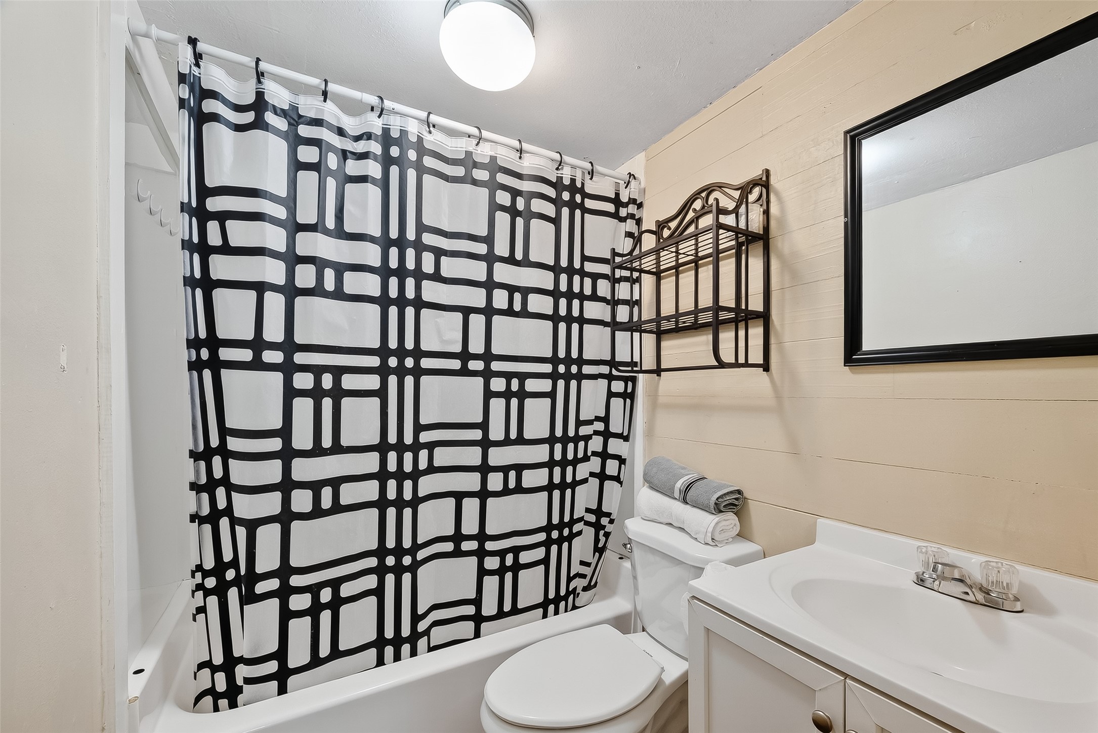 1012 12th Street, Unit UP Dickinson, TX 77539 - Photo 11 of 18 a bathroom with a sink toilet and shower
