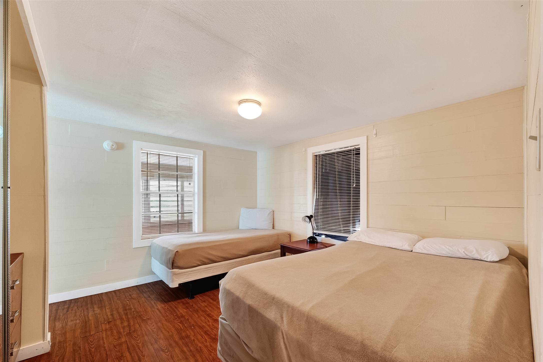 1012 12th Street, Unit UP Dickinson, TX 77539 - Photo 12 of 18 a bedroom with two beds and a window
