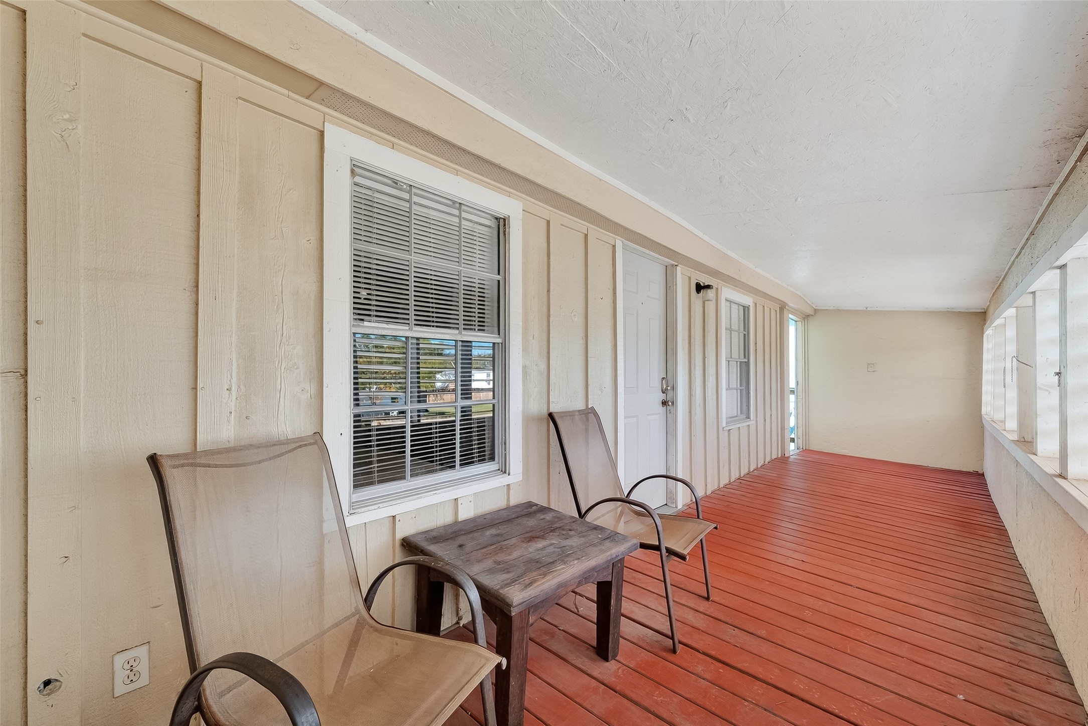1012 12th Street, Unit UP Dickinson, TX 77539 - Photo 14 of 18 a view of a workspace room with wooden floor and furniture