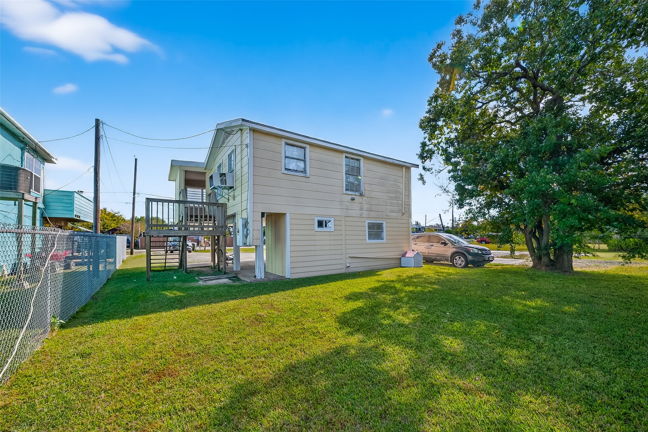 1012 12th Street, Unit UP Dickinson, TX 77539 - Photo 17 of 18 a view of a house with backyard and porch