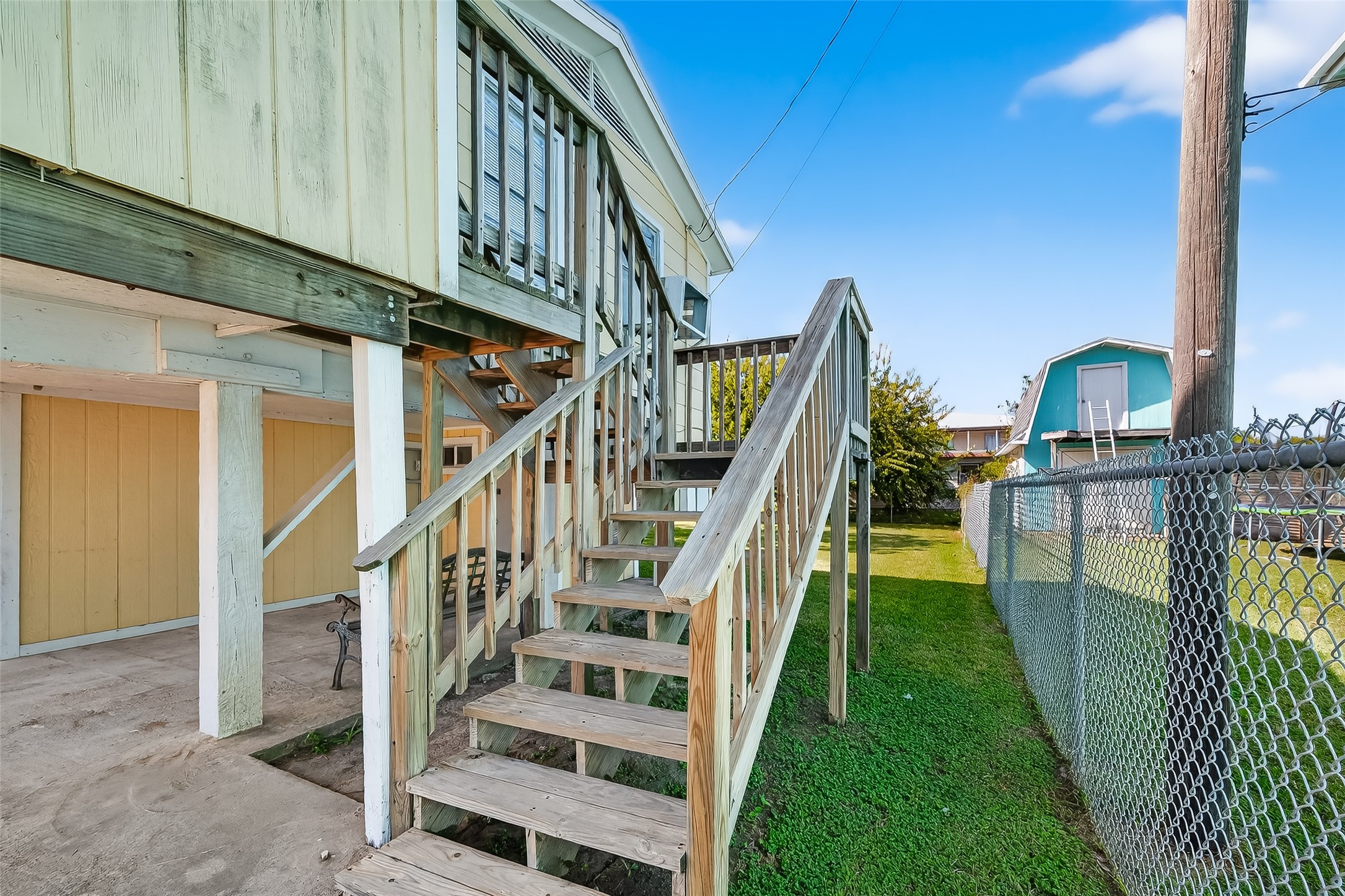 1012 12th Street, Unit UP Dickinson, TX 77539 - Photo 4 of 18 a view of staircase with white walls and railing