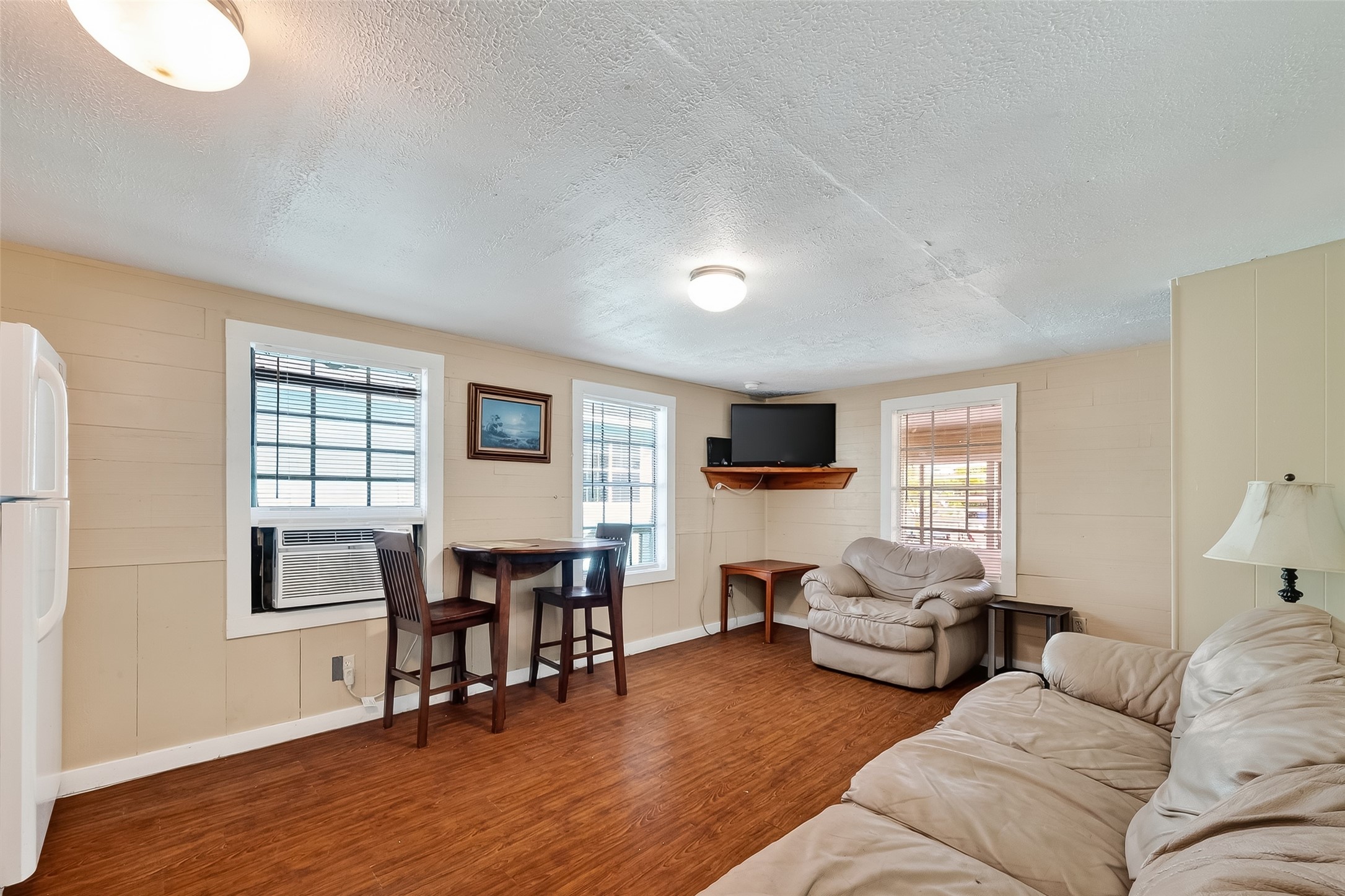 1012 12th Street, Unit UP Dickinson, TX 77539 - Photo 9 of 18 a living room with furniture and a wooden floor
