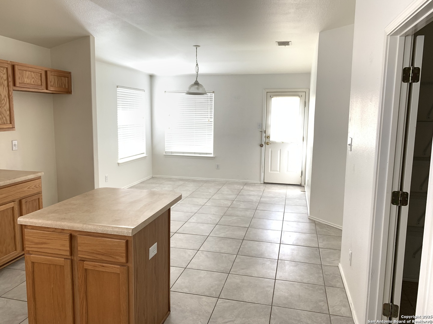 531 Rattler Bluff San Antonio, TX 78251 - Photo 11 of 36 a kitchen with a sink a refrigerator and window