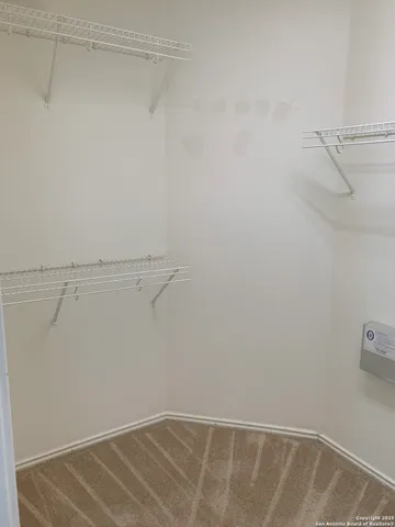 a view of small space with racks on the wall