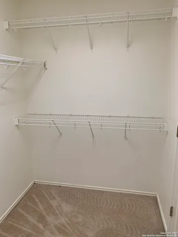 a view of a room with racks on the wall