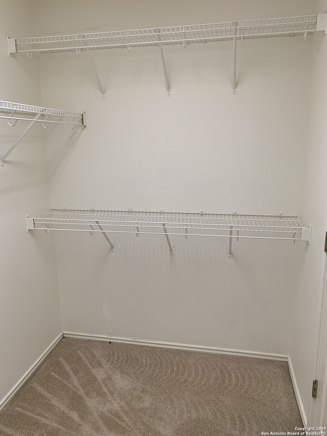 531 Rattler Bluff San Antonio, TX 78251 - Photo 17 of 36 a view of a room with racks on the wall
