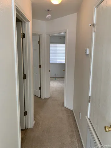 a view of a room with white doors