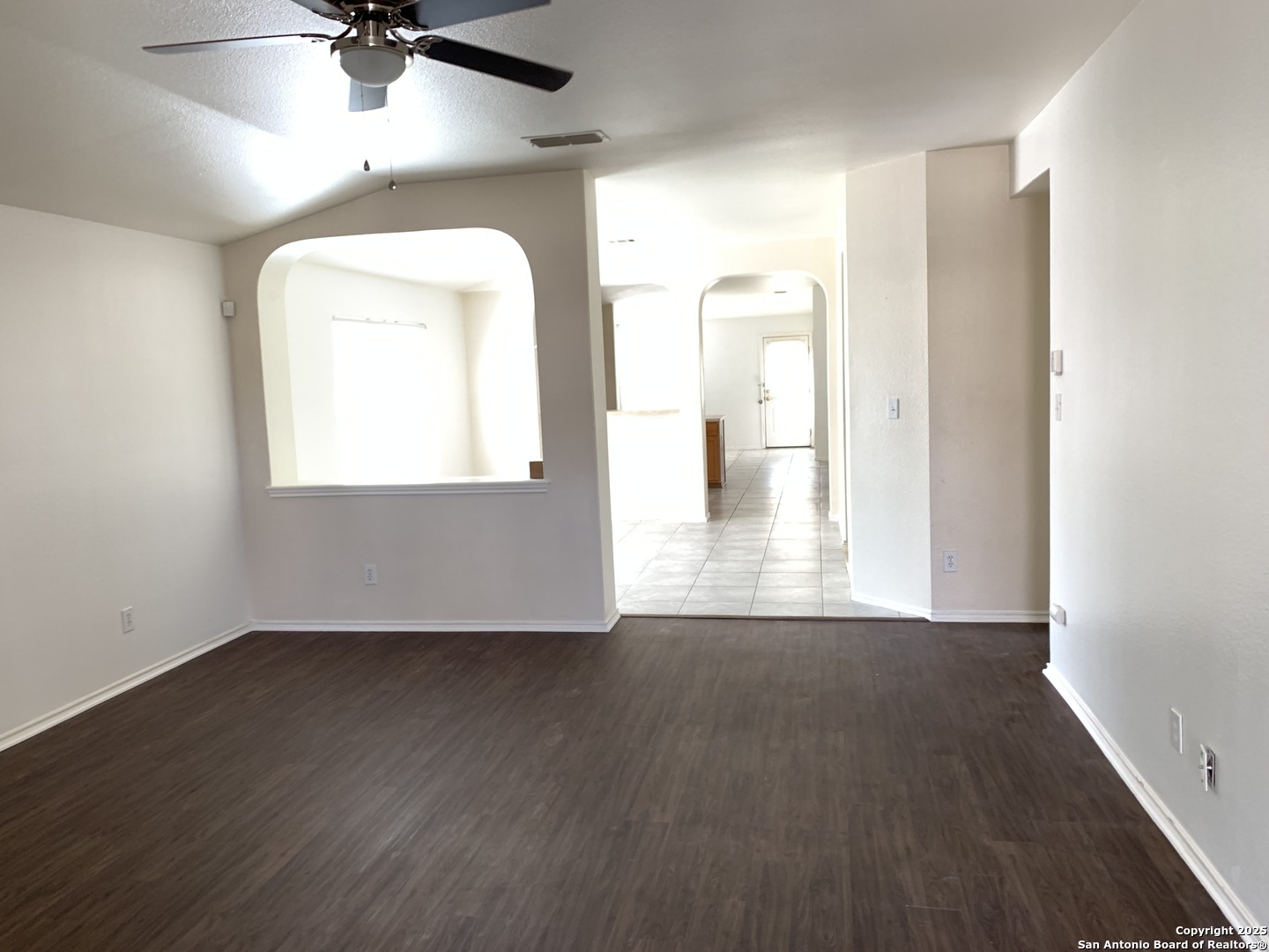 531 Rattler Bluff San Antonio, TX 78251 - Photo 3 of 36 a view of a room with wooden floor and a ceiling fan