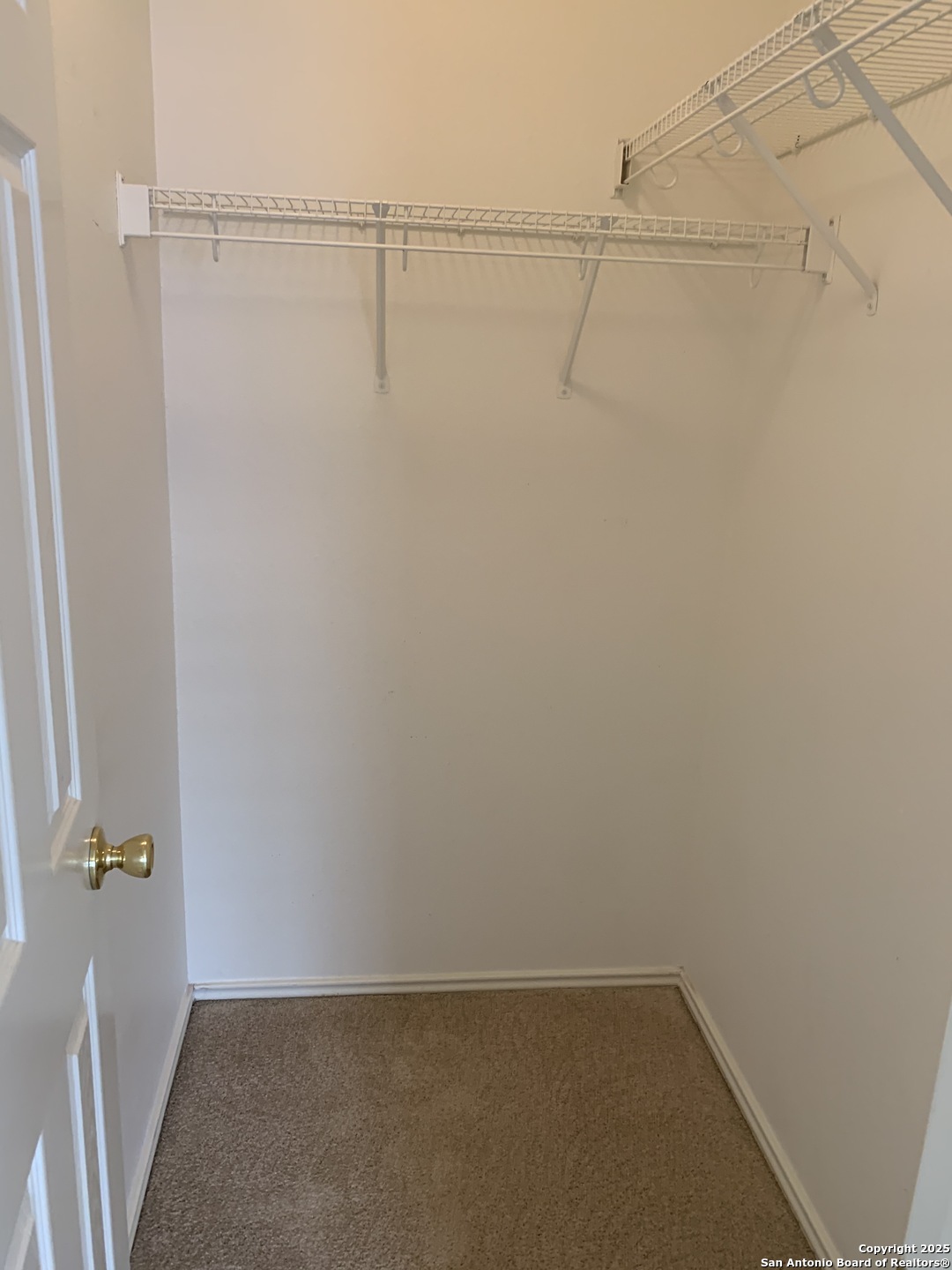 531 Rattler Bluff San Antonio, TX 78251 - Photo 34 of 36 a view of a room with racks on the wall