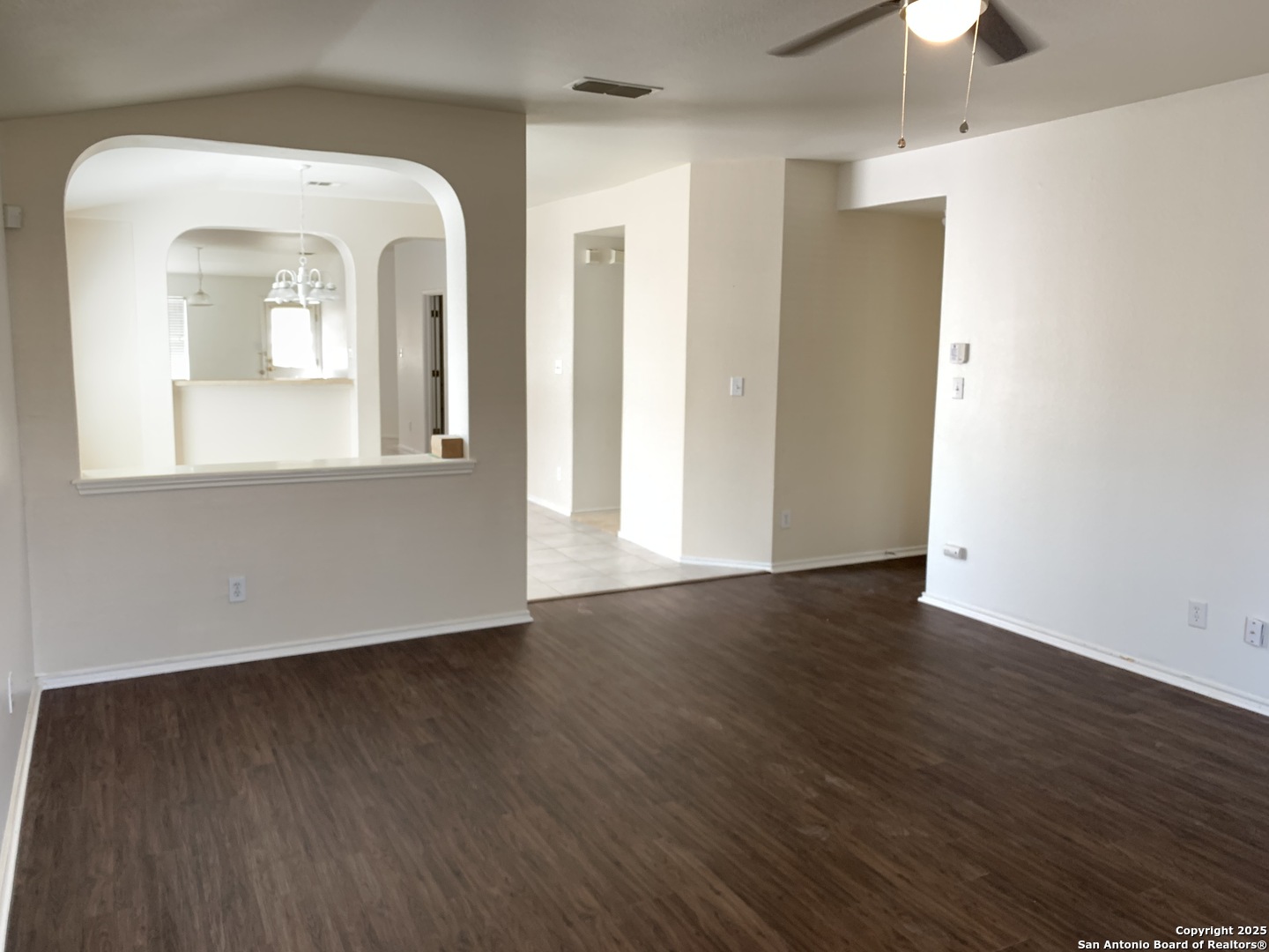 531 Rattler Bluff San Antonio, TX 78251 - Photo 4 of 36 a view of empty room with wooden floor and fan
