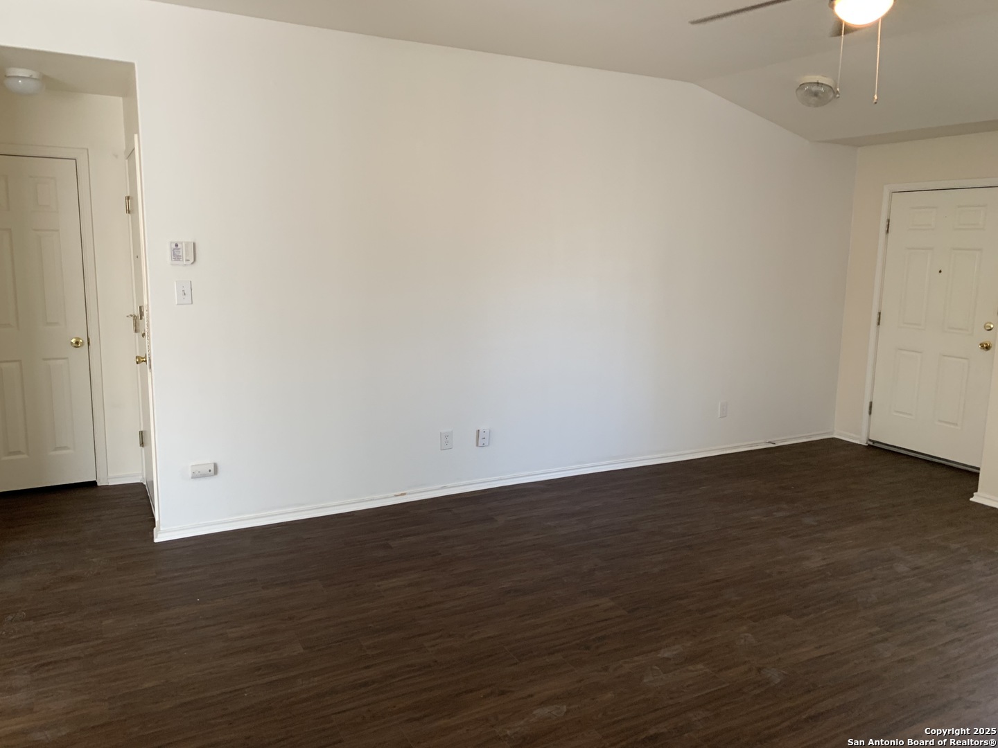 531 Rattler Bluff San Antonio, TX 78251 - Photo 5 of 36 a view of an empty room with wooden floor and a chandelier fan