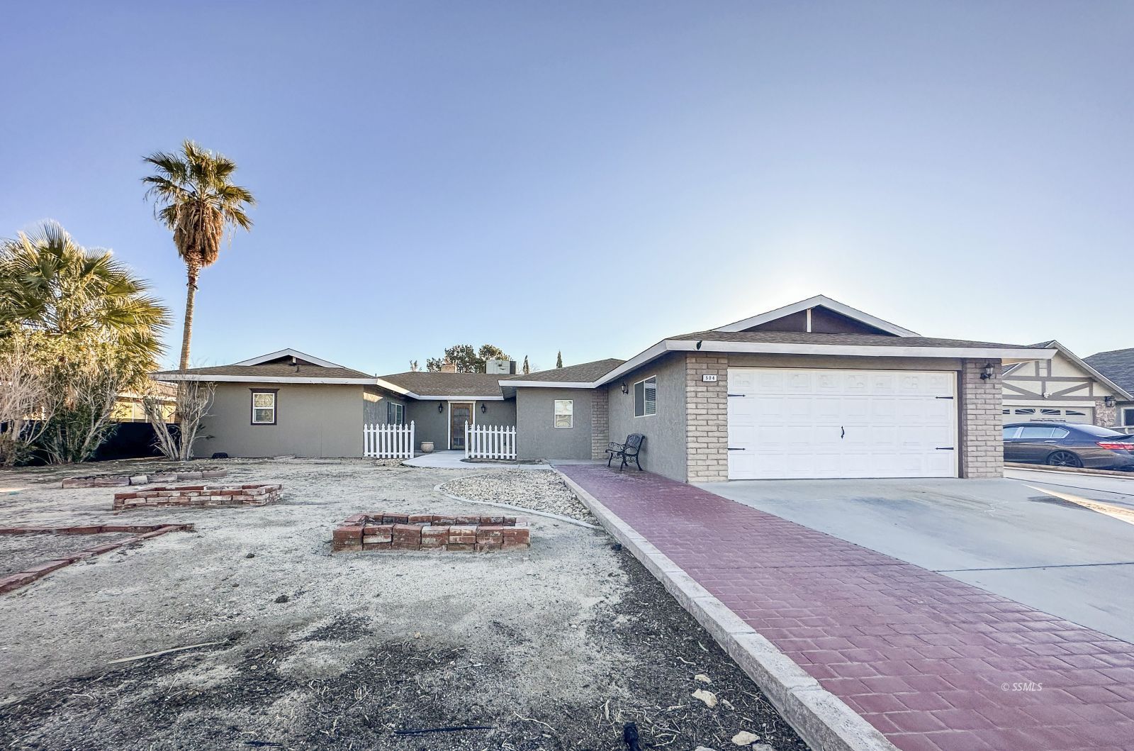 504 Randall Street Ridgecrest, CA 93555 - Photo 1 of 29 a front view of a house with a yard and a garage