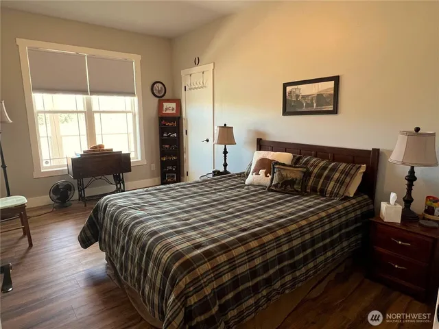a bedroom with bed and window
