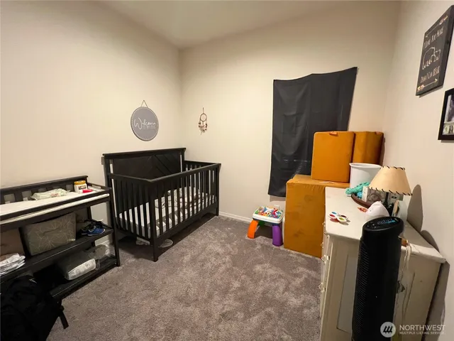 a bedroom with furniture and a window