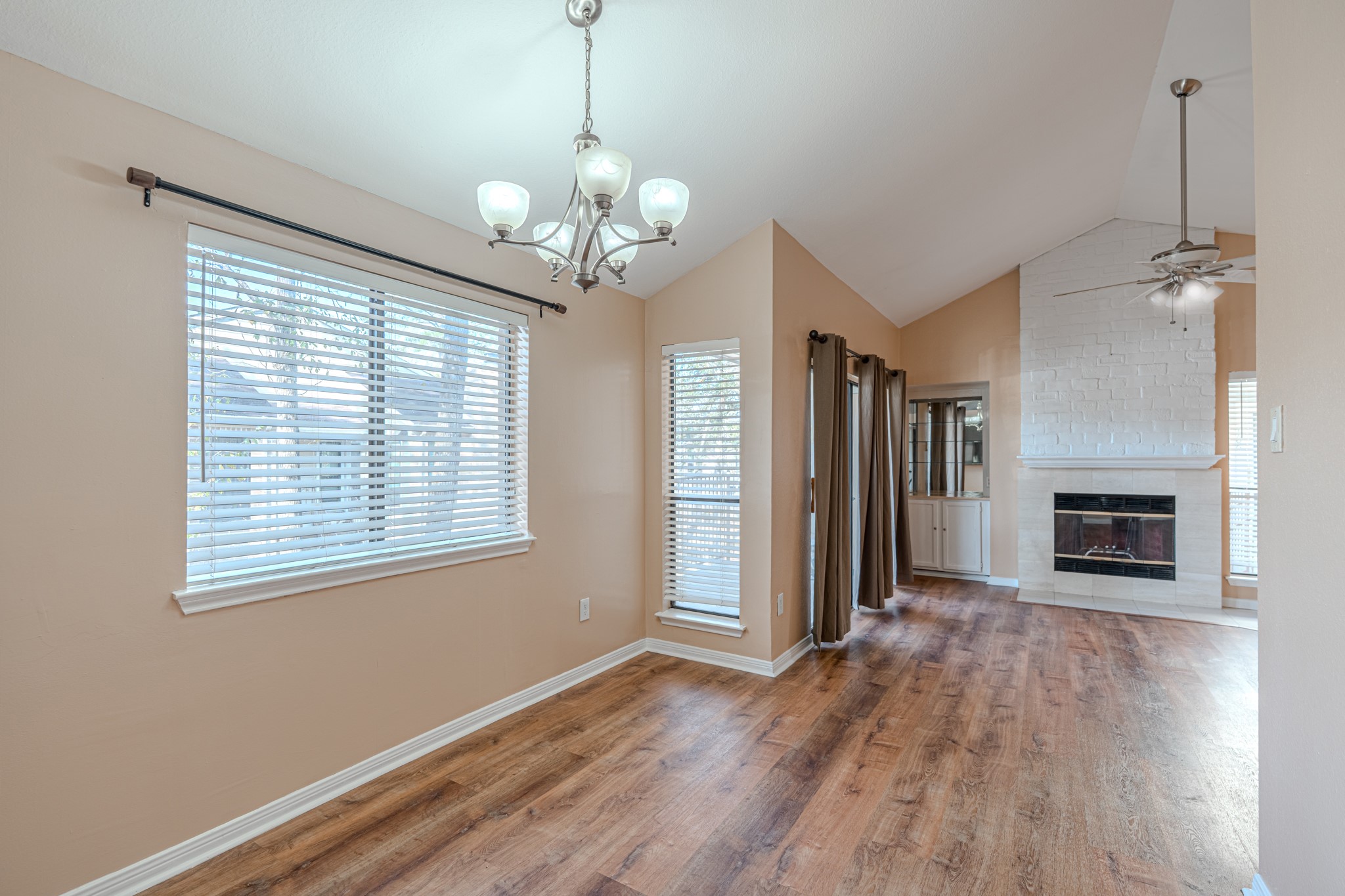 3500 Tangle Brush Drive, Unit 182 Spring, TX 77381 - Photo 11 of 24 a view of a livingroom with wooden floor and a fireplace